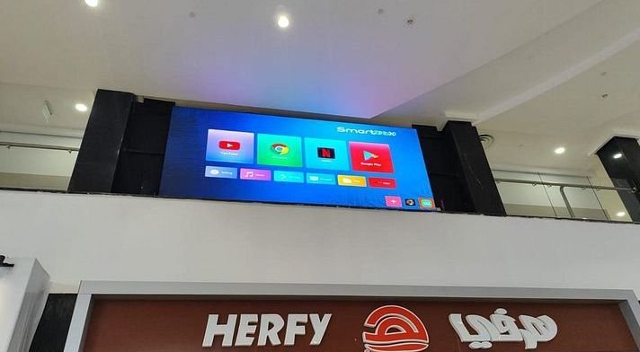 LED screen above a food court counter