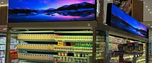 LED banner screen above supermarket shelves