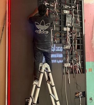 Technician servicing an LED screen